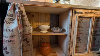 a small cabinet with a bowl on a shelf at Loft Duplex La Industrial Playa in Cádiz