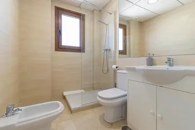 a white bathroom with a sink and a toilet at Penthouse City Center - Jerez in Jerez de la Frontera
