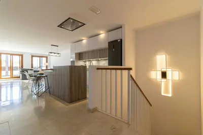 a living room with a kitchen and a dining room at Penthouse City Center - Jerez in Jerez de la Frontera