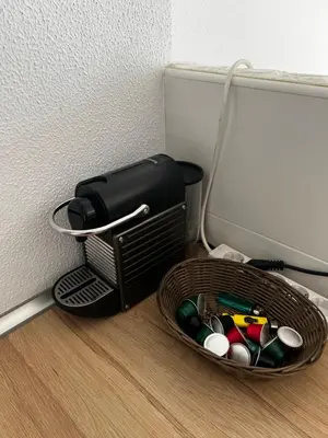 a basket full of office supplies sitting next to a wall at Casa 3 dormitorios La Barrosa in Chiclana de la Frontera
