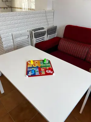 a white table with a toy on top of it at Casa 3 dormitorios La Barrosa in Chiclana de la Frontera