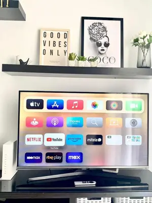 a flat screen tv sitting on top of a shelf at Apartamento Atlántico in Rota