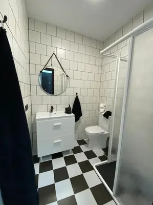 a bathroom with a sink and a toilet and a mirror at Villa con piscina Camino Doñana in Sanlúcar de Barrameda