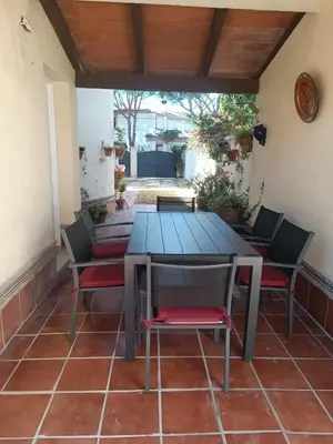 a table and chairs sitting on a patio at Casa Mar Baltico a 200 m de la Playa La Barrosa in Chiclana de la Frontera