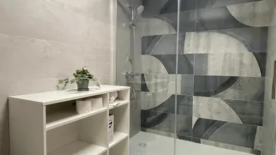 a bathroom with a shower stall and a toilet at Bahia Sur Deluxe in San Fernando