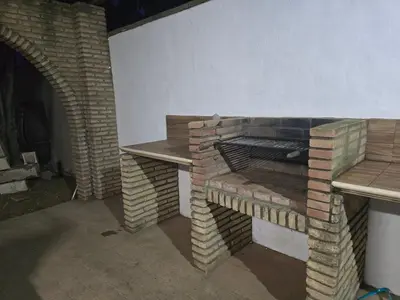 a brick oven sitting next to a brick wall at Sancti Petri in Chiclana de la Frontera