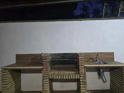 a kitchen with a sink and a bench with a sink at Sancti Petri in Chiclana de la Frontera