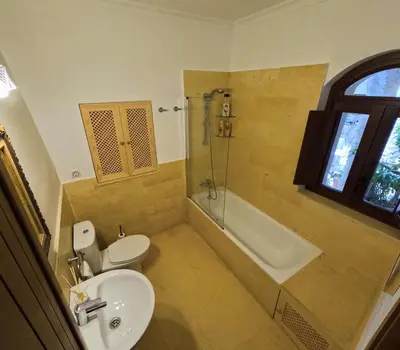a bathroom with a sink and a toilet and a tub at Casa de Medina in Medina Sidonia