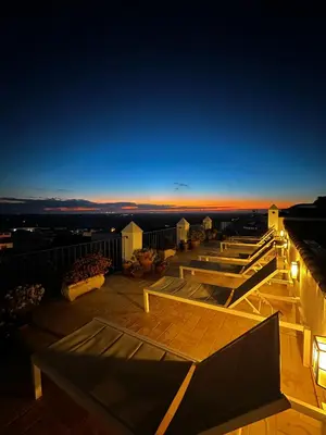 a view of a rooftop deck at night at Casa de Medina in Medina Sidonia