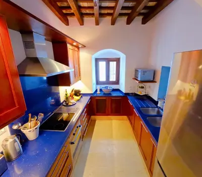 a kitchen with blue counter tops and a blue counter top at Casa de Medina in Medina Sidonia