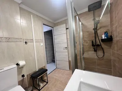 a bathroom with a shower and a white sink at Apartamento chillout centrico in Sanlúcar de Barrameda