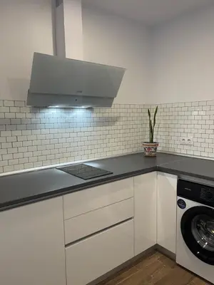 a kitchen with a sink and a stove top oven at Preciosa casa Sol y Luna in Chiclana de la Frontera