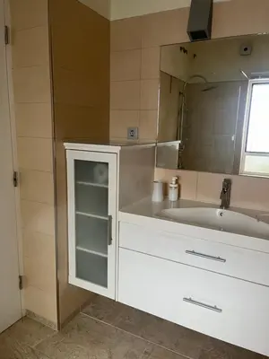 a bathroom with a white sink and a mirror at Mi Teja in Chiclana de la Frontera
