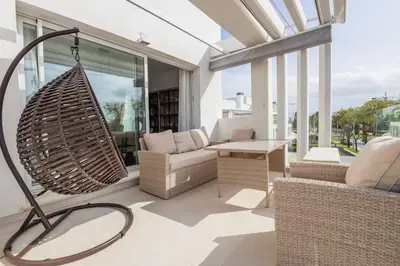 a living room with a hammock in a house at Luxury Beach Townhouse Retreat in Cádiz