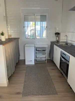 a kitchen with a sink and a counter top at La casa de Cris in Sanlúcar de Barrameda