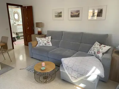 a living room with a couch and a table at Casa Calle Merced in Cádiz