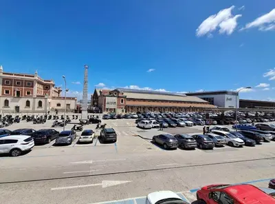 a parking lot filled with lots of parked cars at Casa Calle Merced in Cádiz