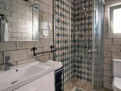 a bathroom with a sink and a shower at Casa Chiclana Centro in Chiclana de la Frontera
