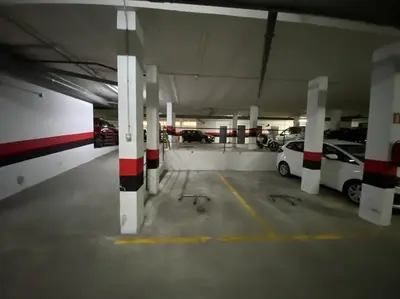 a parking garage with cars parked in it at Apartamento Mati, Terraza 55 m2 in Sanlúcar de Barrameda