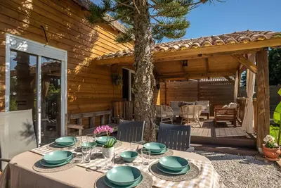 a table with plates on it in front of a house at casa Villa Escondida in Cádiz