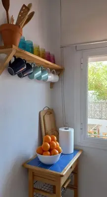 a bowl of oranges on a table in a kitchen at Estupendo adosado en La Barrosa, a 700 m de la Playa in Chiclana de la Frontera