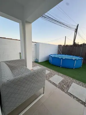 a balcony with a hot tub on a patio at Apartamento El Oasis in Chiclana de la Frontera