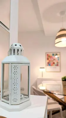 a white lantern sitting on top of a table at Rincón del Atlántico in Rota