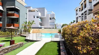 a courtyard with a swimming pool in a building at Rincón del Atlántico in Rota
