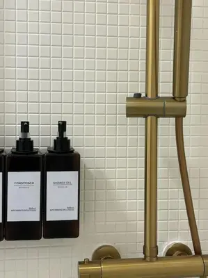 two bottles ofodorizers are sitting on a shelf at Apartamento en el centro histórico in El Puerto de Santa María
