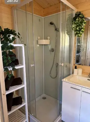 a shower with a glass door in a bathroom at Bungalow Sol in Chiclana de la Frontera