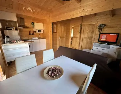 a kitchen with a white table with a bowl on it at Bungalow Sol in Chiclana de la Frontera