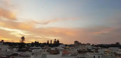 a view of a city at sunset at Apartamento céntrico con garaje opcional in Sanlúcar de Barrameda