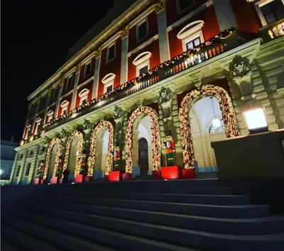 a building with christmas lights and stairs in front at Casa Cervera in San Fernando