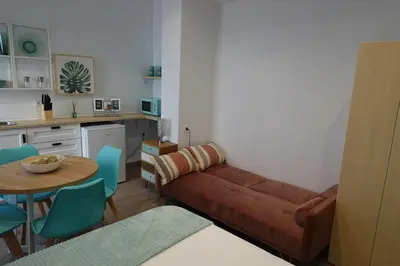 a living room with a couch and a table at Casa Cervera in San Fernando