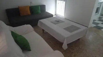 a living room with a couch and a coffee table at Casa del Prendi in Jerez de la Frontera