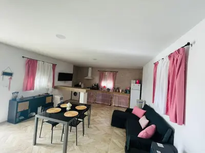 a living room with a couch and a table at Villa Eterno in Chiclana de la Frontera