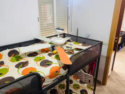 a table in a room with a bed with a tableablish at Villa Eterno in Chiclana de la Frontera