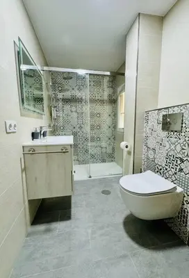 a bathroom with a toilet and a sink and a shower at El Corner de Esquivel Grupo AC Gestion in Cádiz