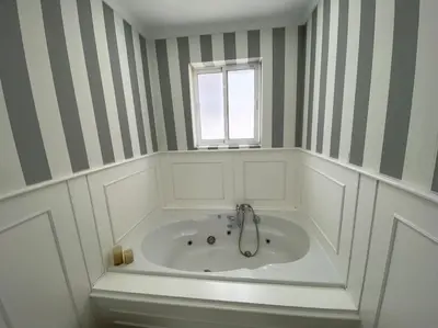 a bath tub in a bathroom with a window at Precioso Ático de Lujo en Calle Ancha in Sanlúcar de Barrameda