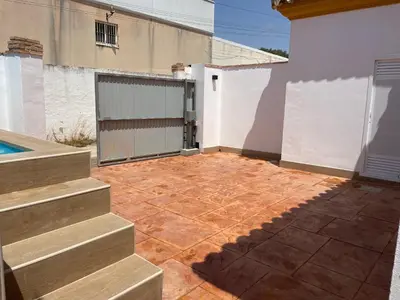an empty patio with stairs next to a building at Casita Kairós in Conil de la Frontera