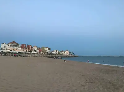 a beach with a group of people in the water at GINVA - MMS Bounty Puerto Sherry Playa in El Puerto de Santa María