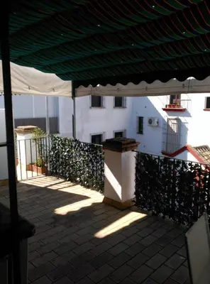a view of a balcony with a green roof at Duplex convento la victoria in Sanlúcar de Barrameda