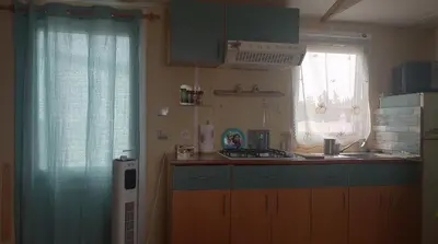 a kitchen with a sink and a counter top at La Vida el Verano en Novo Sancti Petri - Casa Acogedora in Chiclana de la Frontera