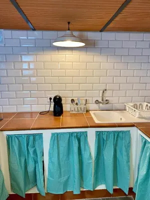 a kitchen with a sink and a counter top at Casa Rural La Yeguada in Malcocinado