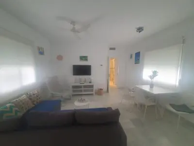 a living room with a couch and a table at Larga 109 in El Puerto de Santa María