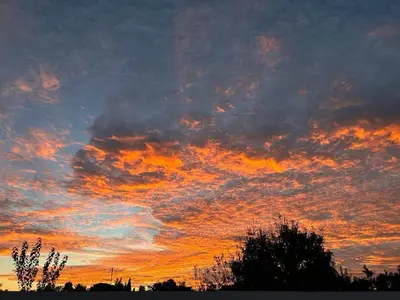 an image of a sunset with clouds in the sky at Habitación en el centro de bienestar TFM in Cádiz