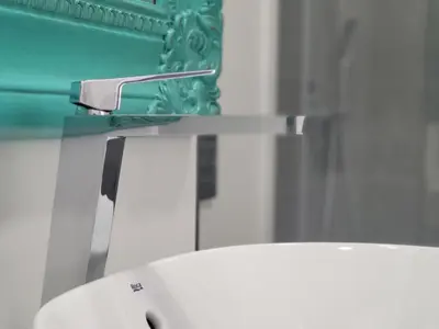 a bathroom sink with a faucet and a mirror at Apartamento Infantas 26 in Sanlúcar de Barrameda
