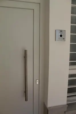 a white door in a room with a staircase at Apartamento Infantas 26 in Sanlúcar de Barrameda