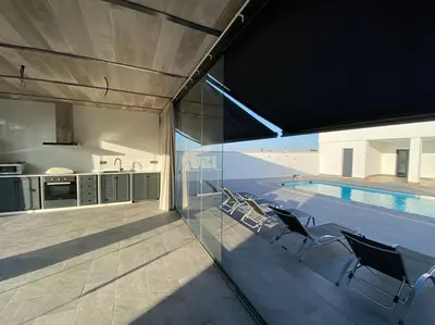 a kitchen with a sink and a refrigerator at Villa Romance in Chipiona