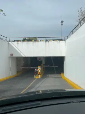 a parking lot with a tunnel with a bridge at Apartamentos Corredera 4 in Arcos de la Frontera